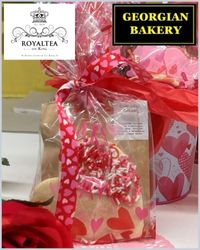 brown bags wrapped in cellophane with red hearts on it. the words Royaltea and Georgian Bakery are written on top