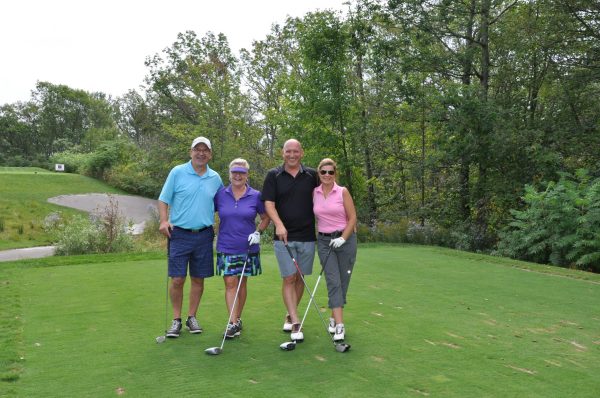 Two men and two women on the golf course