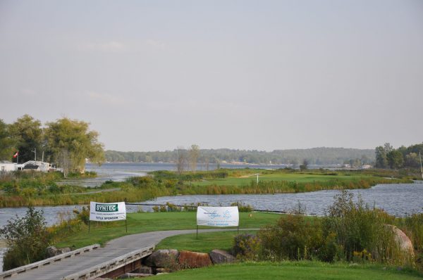 Oak Bay golf course showing a tee block surrounded by water and a bridge to get to it.