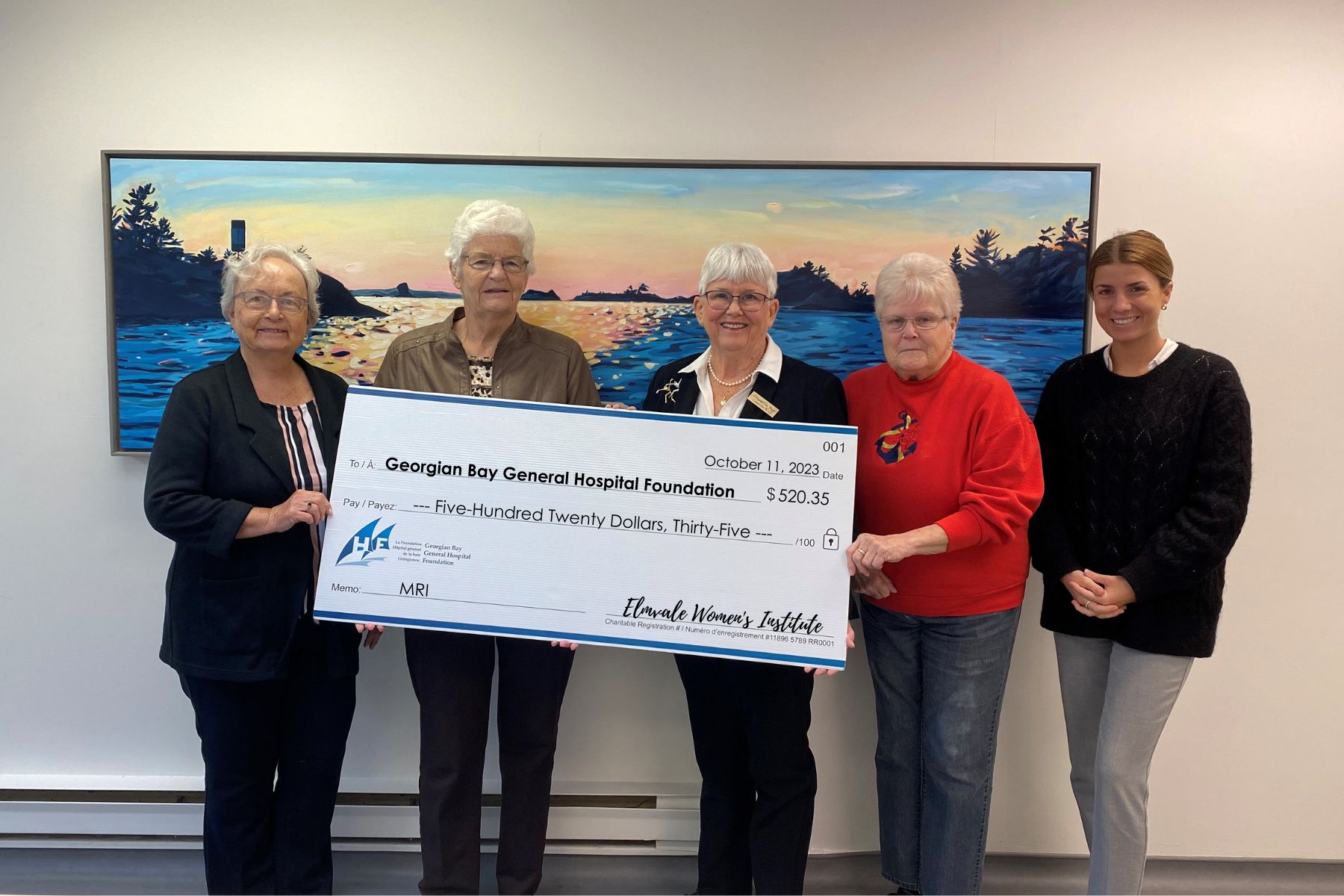 Five women hold a giant cheque made out to the GBGH Foundation MRI fund for $520.35 from the Elmvale Women's Institute.