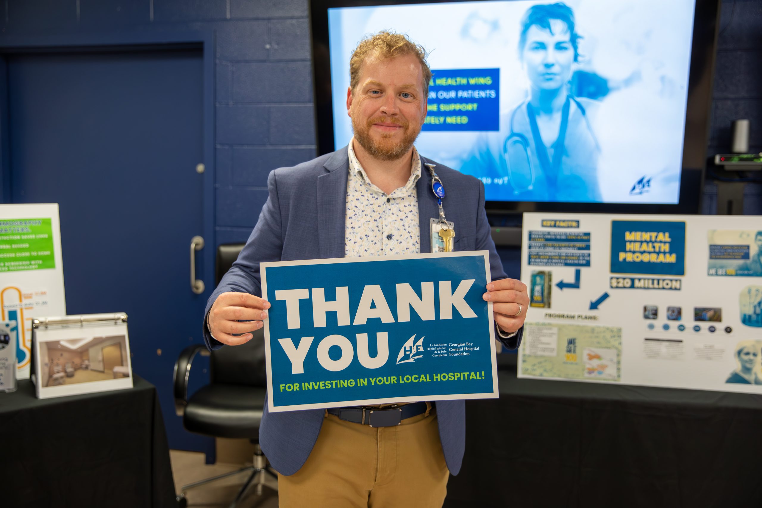 Matthew Lawson, President & CEO of Georgian Bay General Hospital, holding up thank you sign.