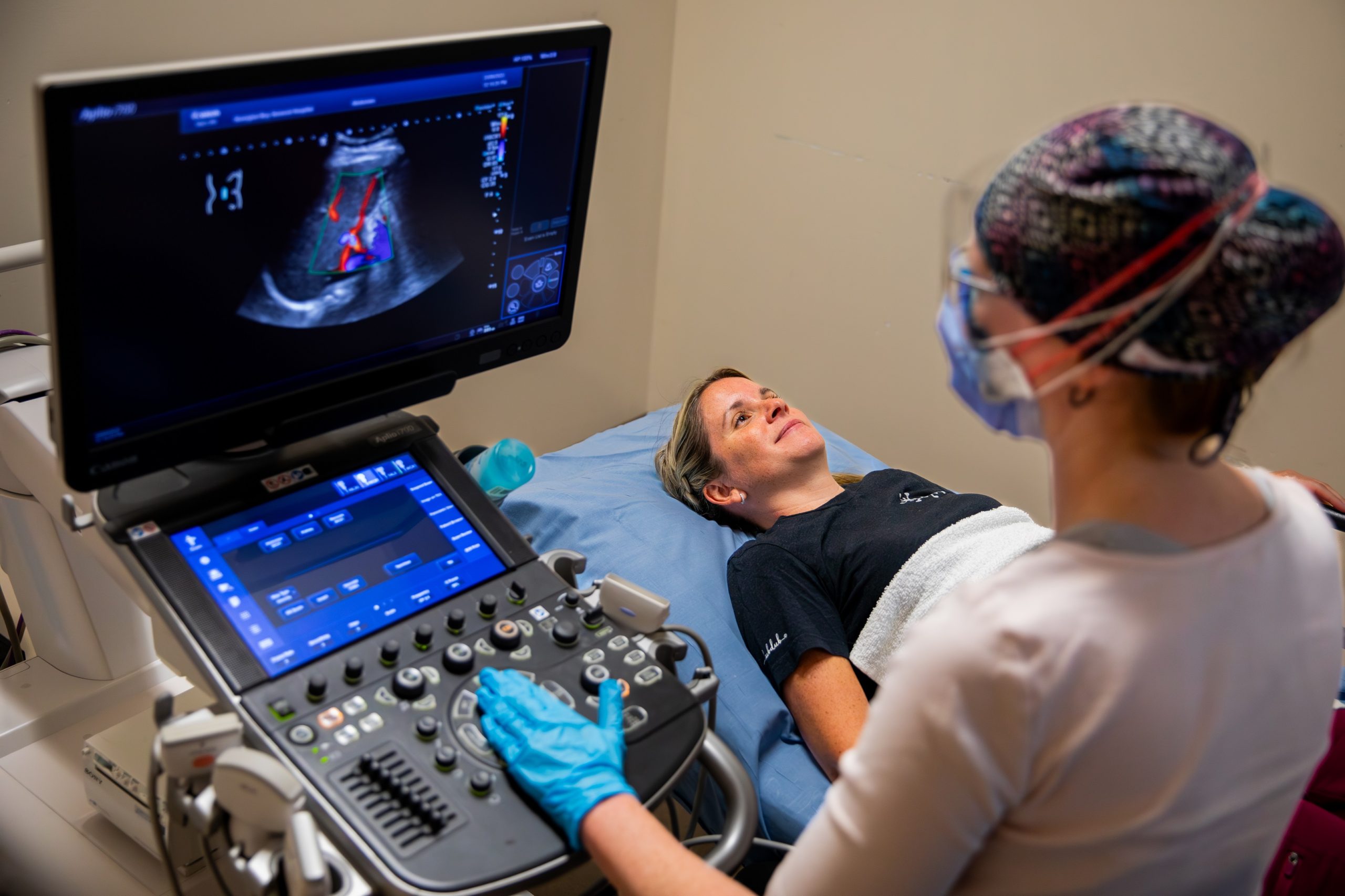 A sonographer uses a new ultrasound machine.