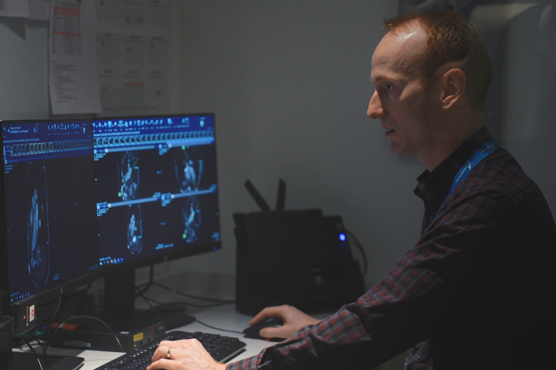 Image of Dr. Nick Lougheed looking at cardiac MRI scans.