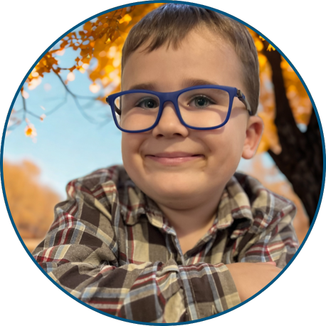 Young boy with blue glasses and a plaid shirt.