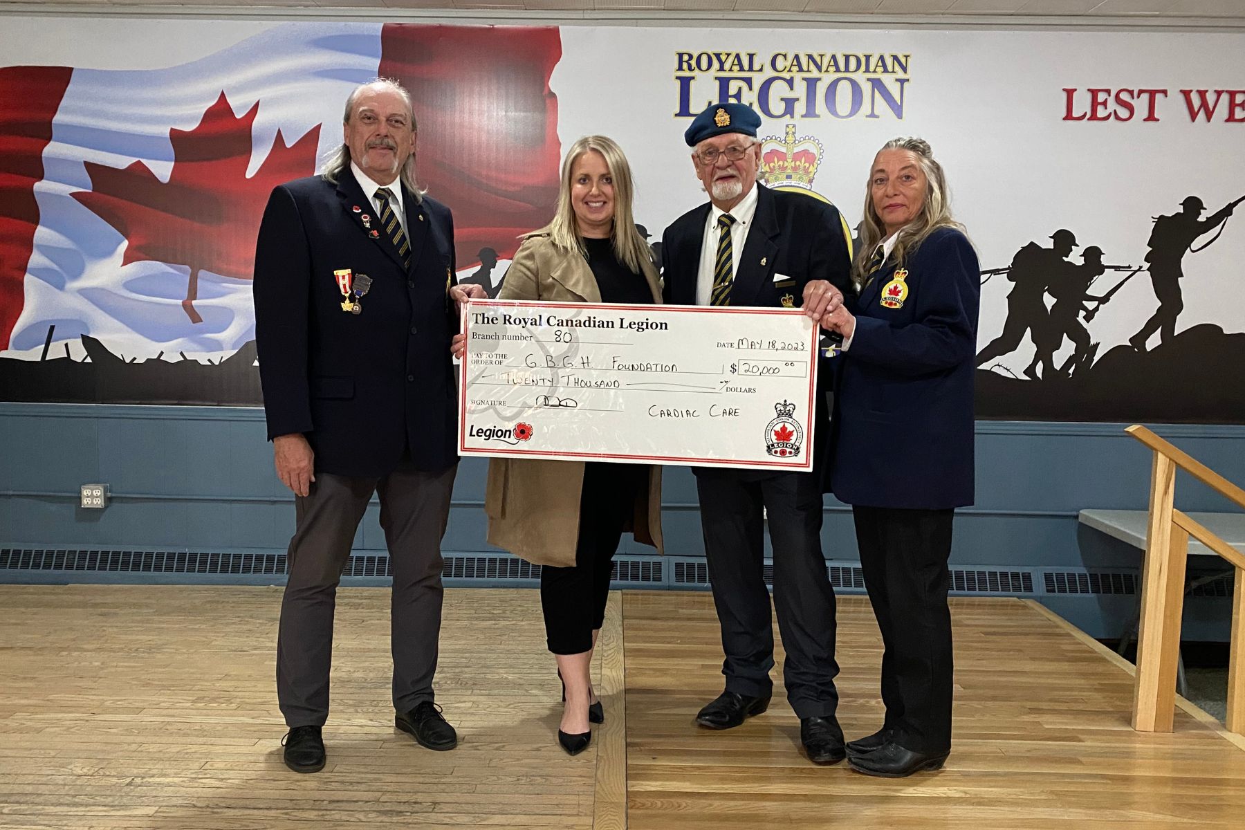 Two men and one women from the Branch 80 Legion present a cheque to a female member of the GBGH Foundation for $20,000 to support Cardiac Care