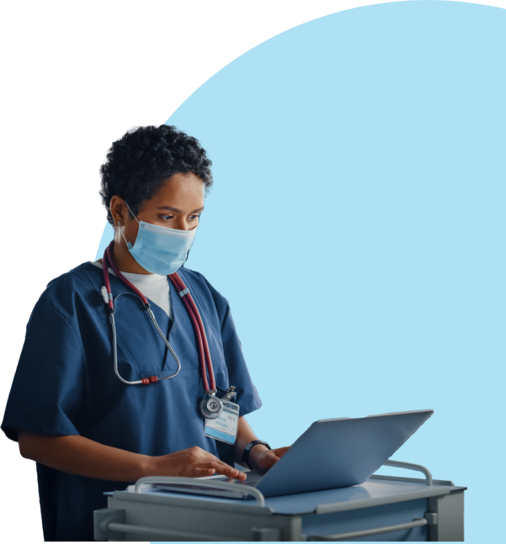 Doctor wearing a mask looking at a laptop screen